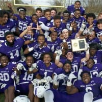 <p>New Rochelle poses with the Section 1 championship plaque.</p>
