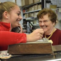 <p>Alexandra Ashley of Allendale and Hanna Gramsch of Upper Saddle River enjoy a light moment amid the holiday frenzy at Reinhold&#x27;s Quality Bakery.</p>