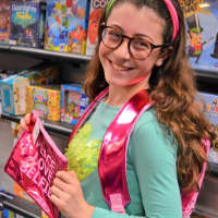 <p>Elisheva of Teaneck checks out the cool backpacks at The Purple Bow in Teaneck.</p>