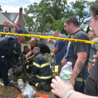 <p>Firefighters rescued a 19-year-old woman and three dogs from a burning house in Islip Terrace.</p>