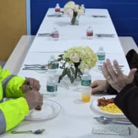 <p>Crossing guards Paul Iulo of Northvale, left, and Paul Wiegartner of Norwood enjoy conversation and a brunch, complements of the Norwood PTO.</p>
