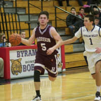 <p>Harrison&#x27;s Zach Evans brings the ball up the court at Byram Hills.</p>