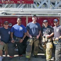 <p>Mt. Kisco firemen pose for a photo at Sale Days.</p>