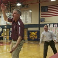 <p>Harrison coach Gary Chiarella tries to get the attention of officials to call a timeout.</p>