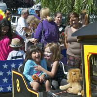 <p>Kids and adults took rides on a mini train that traveled around the Sales Days area.,</p>