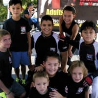 <p>Kids and adults found plenty to do and see at Mount Kisco Sale Days. Kids from Schulman&#x27;s Mixed Martial Arts pose for a photo here.</p>