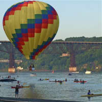 <p>A balloon stays above water at the 2013 festival.</p>