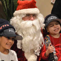 <p>Alanna Hammer and her elated brother, Alex, with Santa.</p>