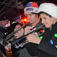 <p>Trumpeters from the Westwood High School band play carols during Santa&#x27;s visit to Alex Hammer&#x27;s house in Washington Township. They volunteered to play.</p>