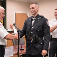 <p>Hillsdale Police Chief congratulates new Patrolman Corey Rooney.</p>