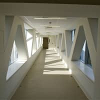 <p>The new walkway bridge between the hospital and a parking garage has a futuristic look.</p>