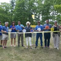 <p>County Executive Marcus Molinaro cuts the ribbon at Wednesday&#x27;s grand opening of the Wilcox Memorial Park Disc Golf Course.</p>