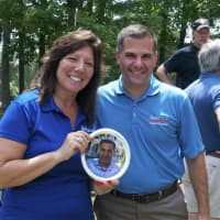 <p>State Sen. Sue Serino and Dutchess County Executive Marcus Molinaro hold up a disc with a photo of Molinaro.</p>