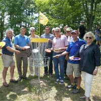 <p>Officials, including Senator Sue Serino (far L) and County Executive Marcus Molinaro (4th from left) celebrate the grand opening of the Wilcox Memorial Park Disc Golf Course.</p>