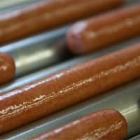 <p>Hot dogs cooking at Red Rooster.</p>