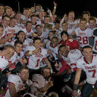 <p>Somers players celebrate after beating Burnt Hills in the New York State Class A semifinal Friday night at Dietz Stadium.</p>