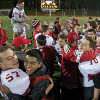 <p>Somers players and fans celebrate the team&#x27;s NYS semifinal victory Friday night at Dietz Stadium.</p>