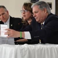<p>Bergen County Executive Jim Tedesco before two stacks of data: the difference between them represents what the county stands to lose in mental health services. With him are Freeholder Director Tracy Zur and Undersheriff Joseph Hornyak.</p>