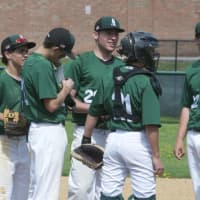 <p>Yorktown pitcher Jim Sharkey (center) talks with his infield during a conference on the mound.</p>