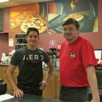 <p>Goodfellas owner Andrew Wiktor stands with John Gonzales in the shop, which has been open since last September.</p>