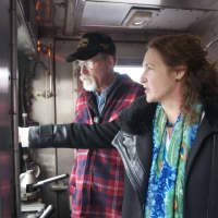 <p>U.S. Rep. Elizabeth Esty tours the Danbury Railroad Museum Thursday, and drives one of the trains. Here, she gets a lesson from Conductor Jim Teer.</p>