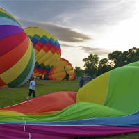<p>Balloons are inflated for a sunrise mass launch the 2013 HV Balloon Festival.</p>