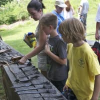 <p>Kids get to check out the tools of the day.</p>