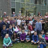 <p>Children from Burr Elementary celebrate Arbor Day by planting a tree.</p>