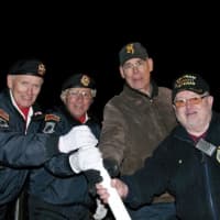 <p>Saturday&#x27;s tree lighting was dedicated to veterans; here four Putnam veterans throw the switch to turn on the holiday lights.</p>
