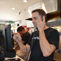<p>Anthony Beninati takes an order at Nino&#x27;s in Hillsdale.</p>