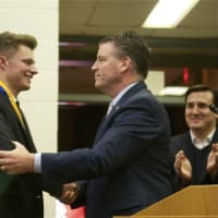 <p>Cullen Malzo is congratulated by NYS Sen. Terrence Murphy.</p>