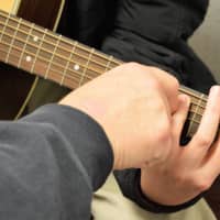 <p>Helping with fingering at Woodside Music Studio.</p>