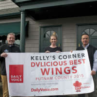 <p>Kelly Quinn (L), Elle Quinn and Daily Voice Director of Media Initiatives/Managing Editor Joe Lombardi hold banner announcing Kelly&#x27;s Corner as &#x27;Best Wings in Putnam&#x27; winner.</p>