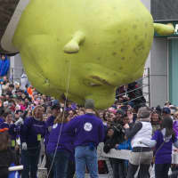 <p>Shrek gives a kiss to members of the crowd.</p>