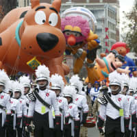 <p>The Stamford Parade makes its way down Atlantic Street on Sunday afternoon.</p>