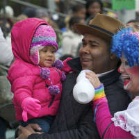 <p>A clown plays with a young child at Sunday&#x27;s Stamford Parade.</p>