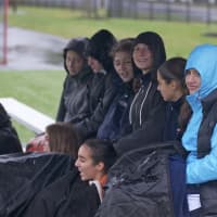 <p>The Greeley bench tries to stay dry and warm.</p>