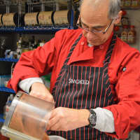 <p>Robert Feuerstein at work in the kitchen at SMOKED on Godwin Avenue in Ridgewood.</p>