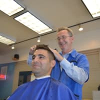 <p>Hillsdale barber Tim Kane works on Jordan Kapp of Paramus, a guidance counselor at Pascack Valley High School. He came to get his haircut on his lunch break and said he liked the old-school barbershop feel.</p>