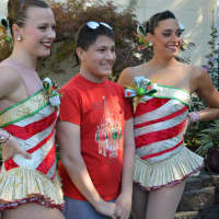 <p>Chris Roberts of Elmwood Park enjoys a moment in the spotlight with two Rockettes at Van Dyk&#x27;s Homemade Ice Cream in Ridgewood.</p>