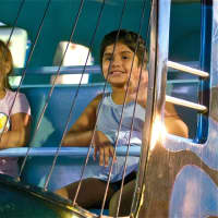 <p>Two kids enjoy a helicopter ride at the Dutchess County Fair.</p>