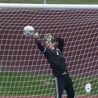 <p>Carmel keeper Brian Sposato goes high to make a save in a loss to Brewster Saturday at Carmel.</p>