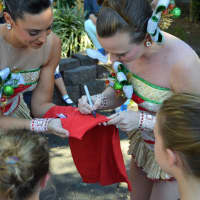 <p>Autographing a Christmas Spectacular shirt.</p>