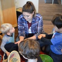 <p>HealthBarn USA Educator Alyssa D&#x27;Amico of Mahwah introduces children to edamame, an ingredient in the lasagna roll-ups they were about to make. &quot;It will help you build big muscles,&quot; she said.</p>