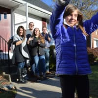 <p>Talia DeGennaro greets the crowd after &quot;George To The Rescue&quot; revealed weeks-worth of renovations to her family in Rutherford.</p>