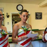 <p>Rockettes Sarah Staker, left, and Nicole Baker Luftig present a certificate to the owners of Van Dyk&#x27;s Homemade Ice Cream - Corinna and Demetrios Kotrokois.</p>
