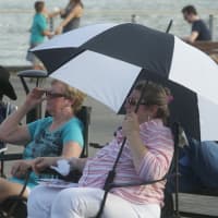 <p>Many brought umbrellas to try to beat the heat on a 95-degree afternoon in Cold Spring.</p>