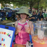 <p>A young girl offers a great deal on cold lemonade on a steamy afternoon.</p>