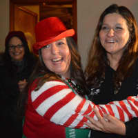 <p>Fair Lawn Human Services Coordinated Liz Maresca as Santa&#x27;s Helper hugs Nicole DeFontes, best friend Kristine Ligierri looks on.</p>