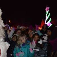 <p>Santa hands out candy canes at Christmas on Vanore.</p>